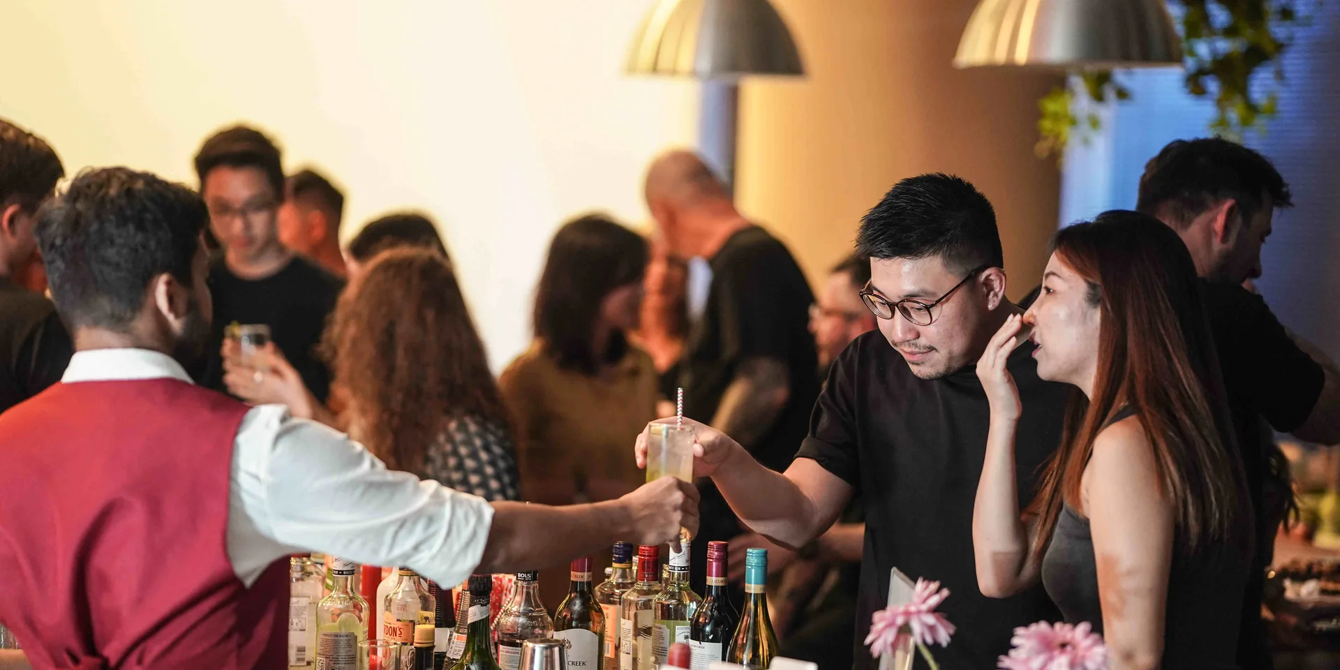 Bartender creating cocktails at an elegant Singapore event
